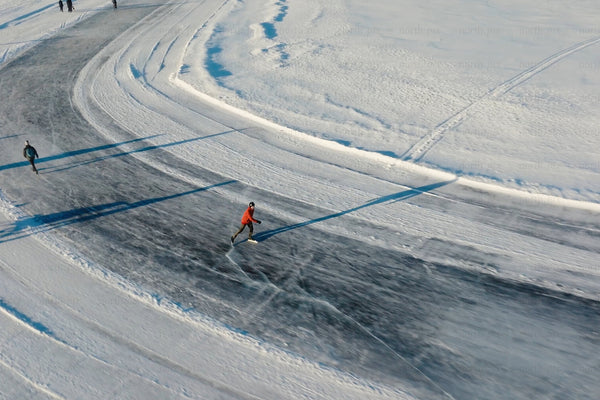 Outdoor ice skating on curved frozen surface in Luleå city center, winter activity