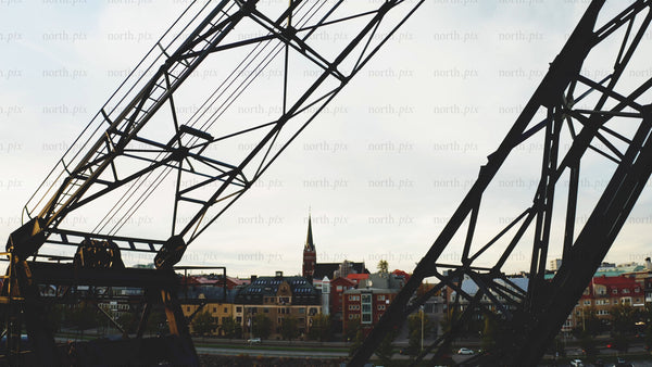 Autumn evening in Luleå: City landscape silhouette with crane and church