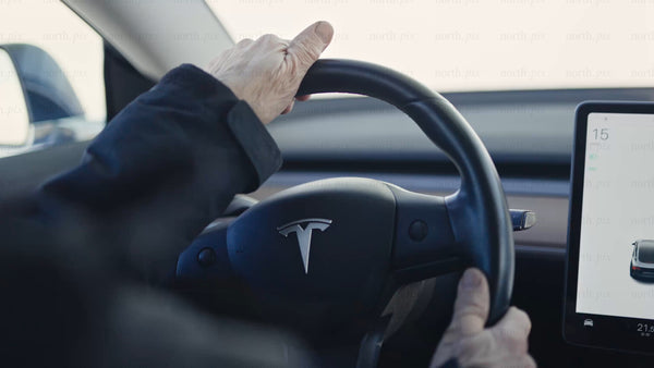 Tesla/car on an ice road in Luleå: Daytime POV close-up