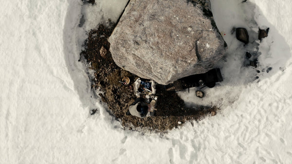 Man cooking outdoors in winter landscape, Luleå archipelago