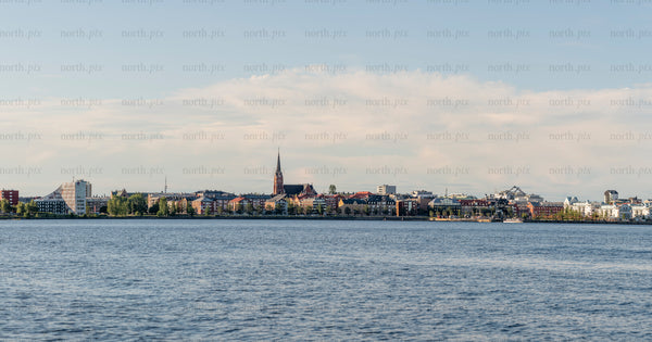 Panoramic waterfront city skyline in summer afternoon