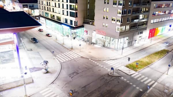 Luleå at night: Aerial timelapse of cityscape, roads, buildings, and water
