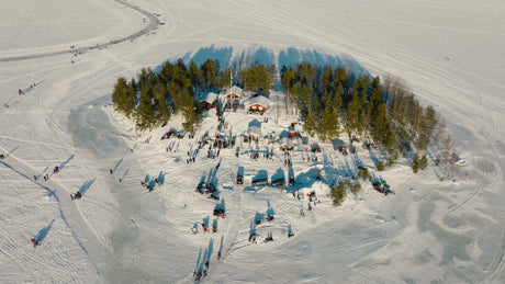 Winter Wonderland in Lulea, Sweden: Aerial View of Snowy Island, Frozen Lake, and Ice Skating