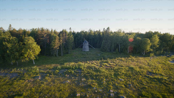 Summer evening drone shot of a windmill in Luleå