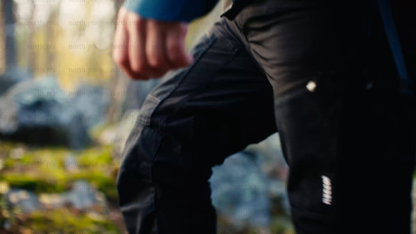Hiker in autumn forest, Luleå: Close-up of legs and feet