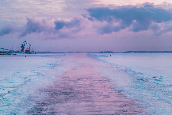 Ice channel through frozen sea at winter morning