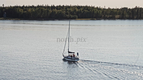 Sailing on Lulea River in Sweden on Sunny Summer Day, Aerial Drone Footage