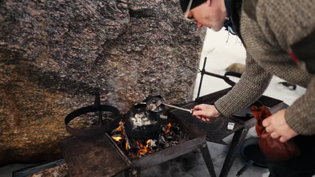 Winter Cooking in Luleå Archipelago: Man Prepares Campfire by the Coast
