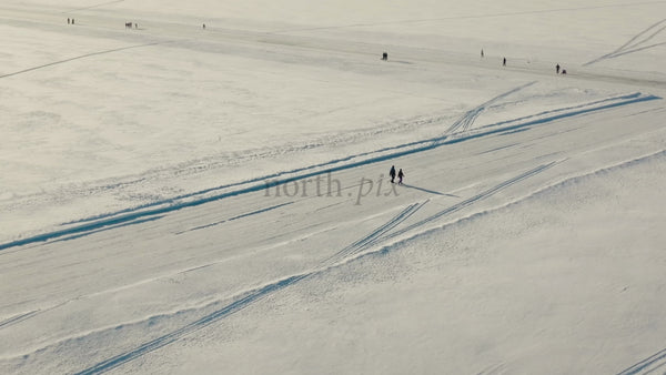 Winter Wonderland in Lulea, Sweden: Aerial Drone Footage of Snowy Landscape and Frozen Lake Activities