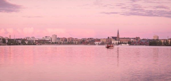 Panorama of waterfront town at sunset