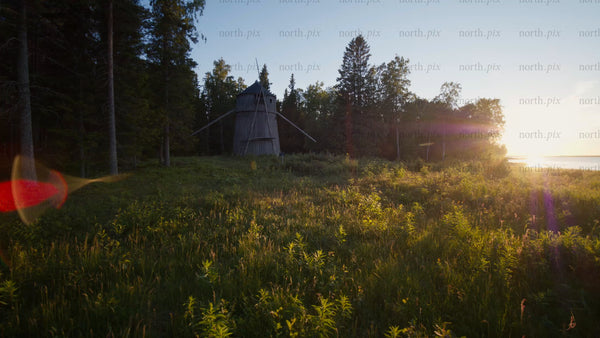 Old windmill at golden hour in Luleå archipelago