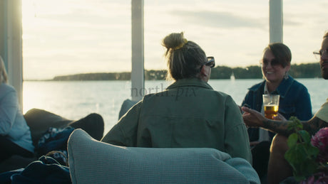 Friends Enjoy Sunset Drinks on a Boat in Lulea, Sweden