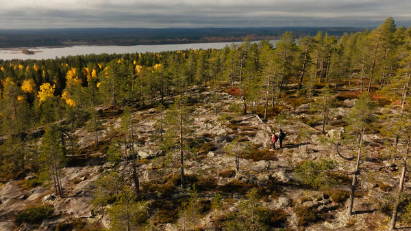 Autumn hike in Luleå: Drone view of hikers on Bällingeberget by the Luleälven