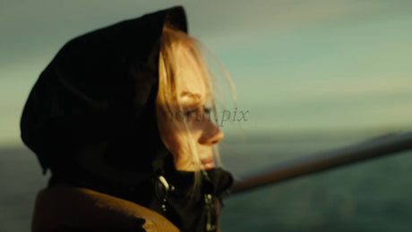 Woman on Scenic Boat Trip in Luleå Archipelago During Golden Hour