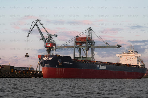 Bulk carrier at port during sunset