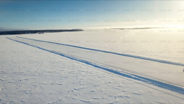 Driving on a frozen ice road in the Luleå archipelago, in winter