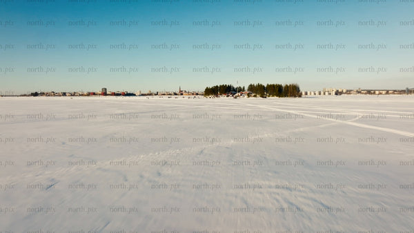 Winter in Luleå: Aerial drone footage of frozen lake and island gathering