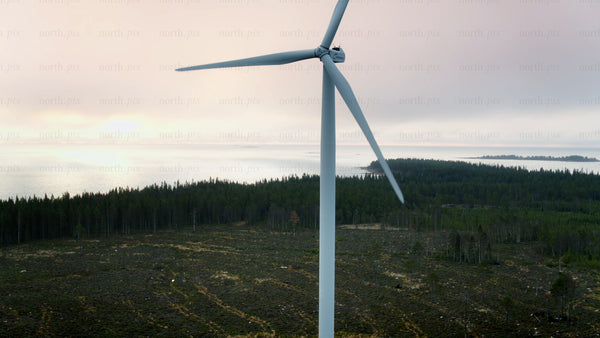 Rotating wind turbine at dawn: Haraholmen. Sustainable energy