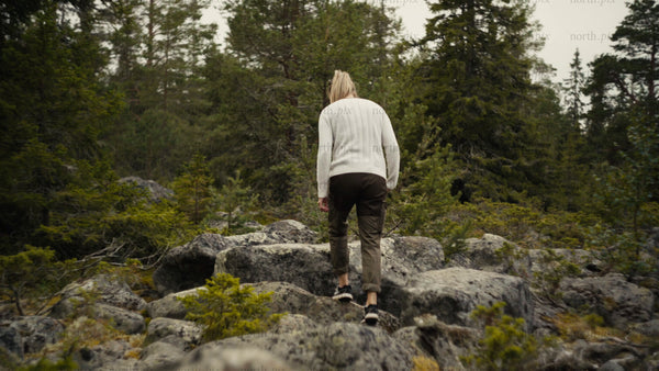 Woman hiking in Luleå archipelago on an overcast summer day