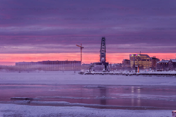 Harbor crane at sunset in winter