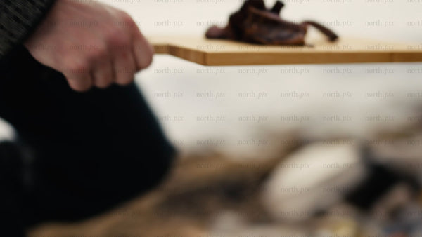 Cooking moose and potatoes over a campfire in the Luleå archipelago