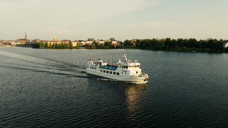 M/S Laponia Passenger Ferry Cruising on Lule River in Luleå, Sweden, During a Summer Evening