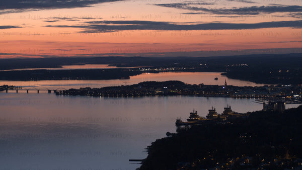 Luleå at sunset: An aerial view of city, bridge, and ships
