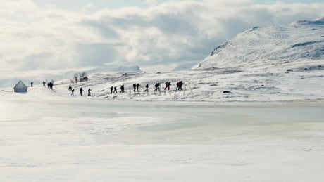 Winter Hiking Adventure in Riksgransen, Sweden: Exploring Snowy Mountains and Frozen Lake