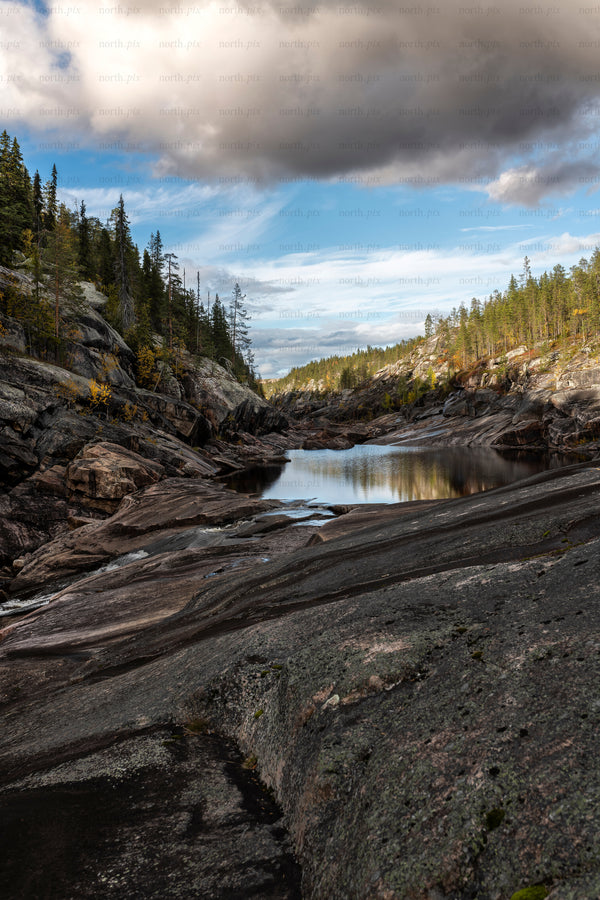 Jokkmokk - rocky river gorge with pine forest and pool