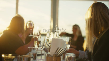 Friends Enjoying Sunset Dinner in Lulea, Sweden: Summer Celebration and Togetherness