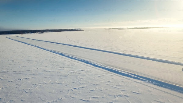 Driving on a frozen ice road in the Luleå archipelago, in winter