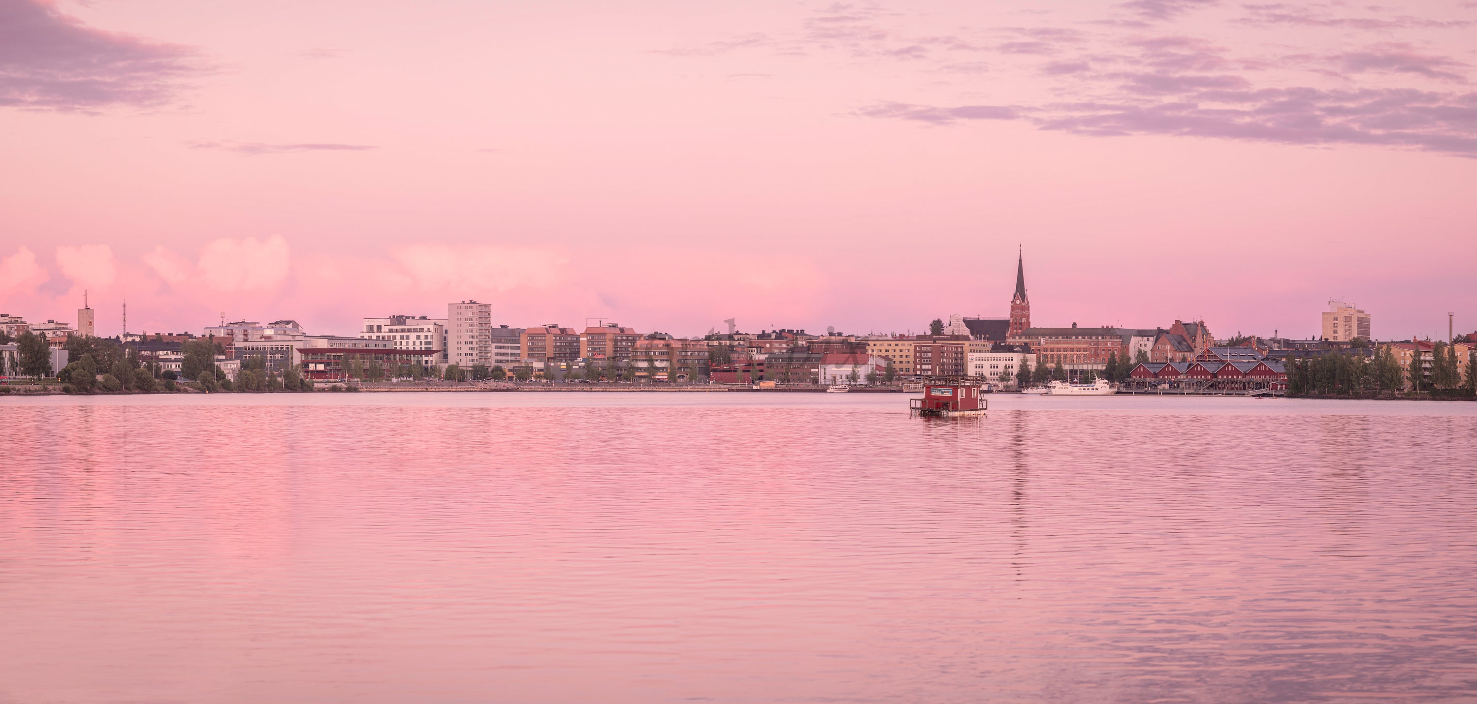 Panorama of waterfront town at sunset