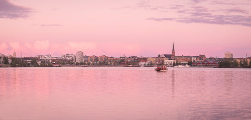 Panorama of waterfront town at sunset