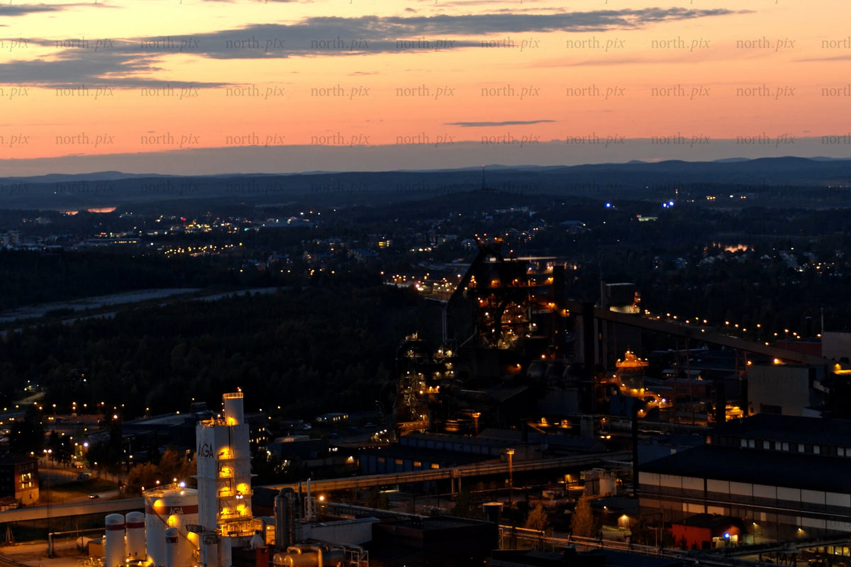 Industrial plant at sunset over Luleå city center: Nighttime Lights and industrial skyline