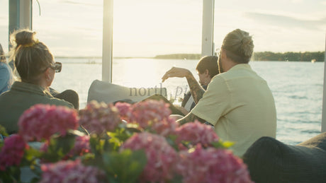 Relaxing Sunset River Cruise in Lulea, Sweden: Friends and Family Enjoying Summer Vacation