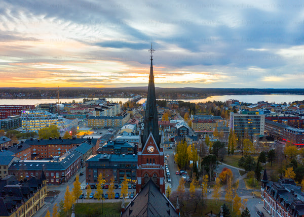 Aerial view of Luleå in autumn during sunset with church as focal point