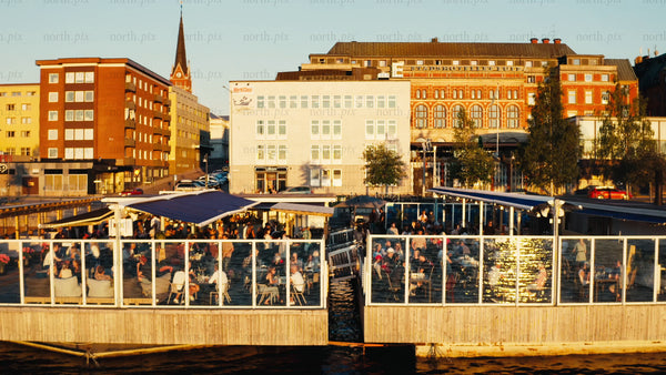 Luleå waterfront restaurant: Summer evening with people enjoying sunset views