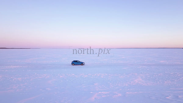 Winter Sunset Drive on a Frozen Ice Road in the Luleå Archipelago, Sweden