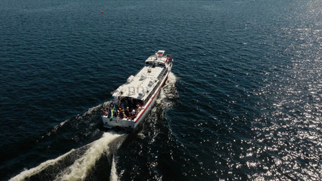 Tour Boat on the Lule River in Lulea, Sweden, on a Summer Day, Aerial Drone View