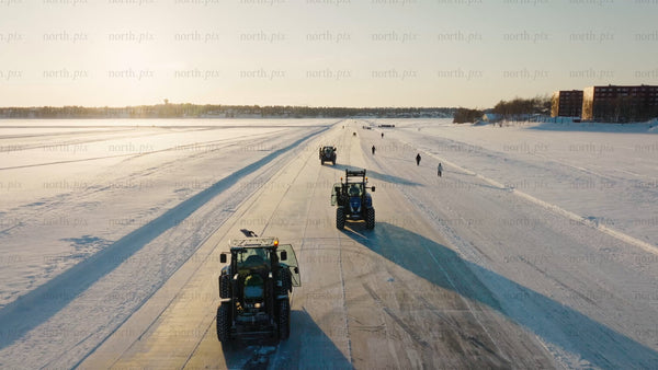 Winter road maintenance in Luleå: Tractors clearing snow on ice