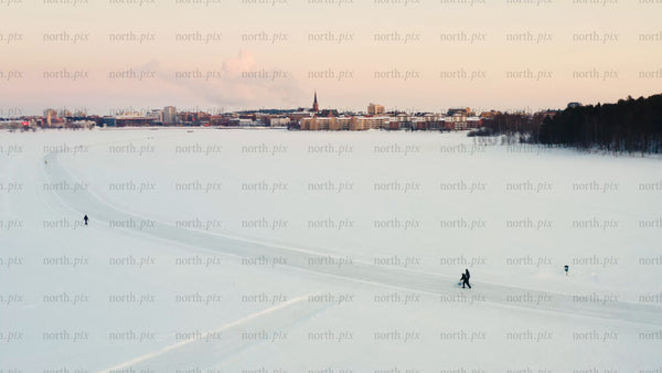 Winter wonderland in Luleå: Skiing on a frozen lake at sunset