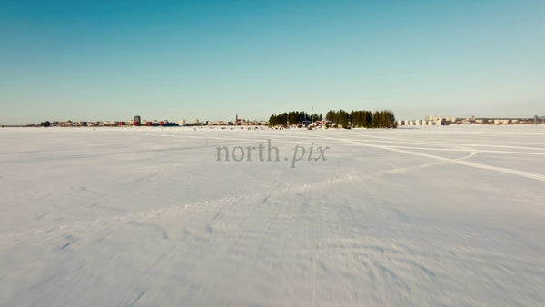 Winter in Lulea, Sweden: Aerial Drone Footage of Frozen Lake and Island Gathering
