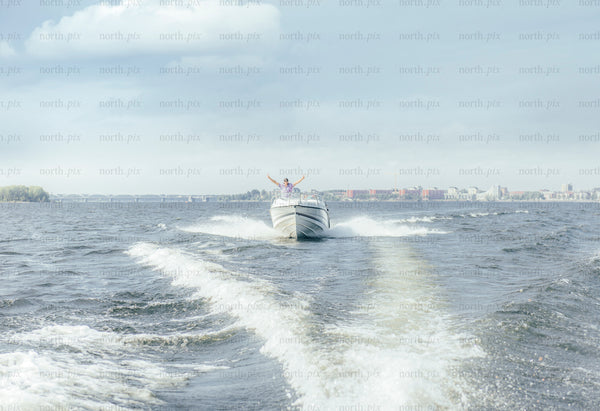 Speedboat crossing open water on a cloudy day