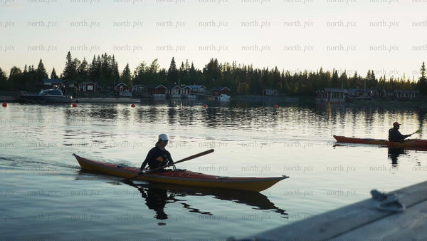 Kayaking in the Luleå archipelago at sunset during summer