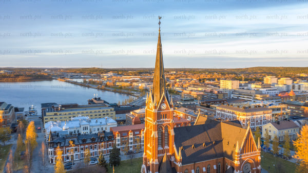 Aerial timelapse of Luleå cathedral and cityscape at sunset