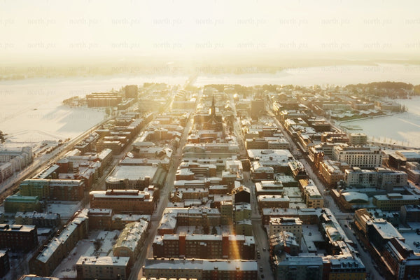 Aerial view of Luleå city center at sunrise in snowy winter morning