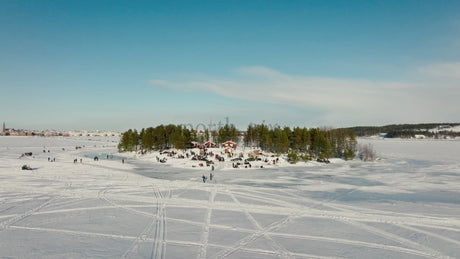 Winter Wonderland in Lulea, Sweden: People Gather on a Frozen Lake Island