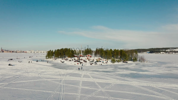 Winter Wonderland in Lulea, Sweden: People Gather on a Frozen Lake Island