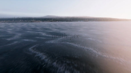 Frozen Lake in Arvidsjaur, Sweden: Winter Sunset Drone View