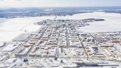 Aerial Timelapse of Snow-Covered Lulea, Sweden in Winter